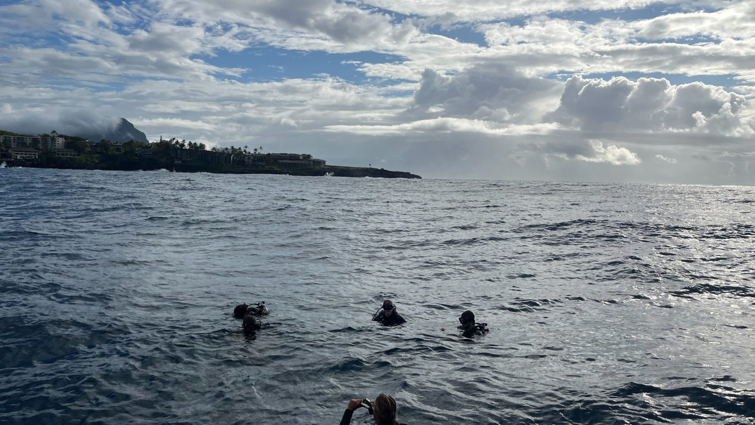a group of people in a large body of water
